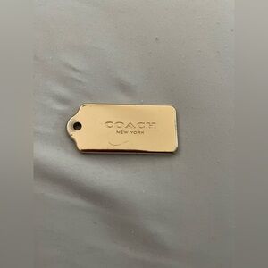 Coach Gold-Tone Tag